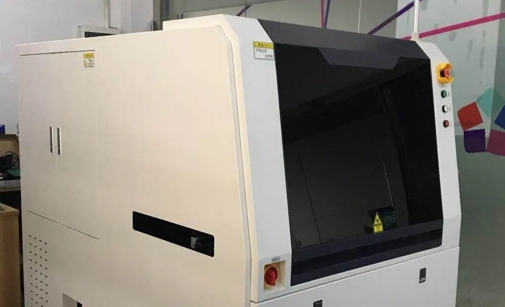 Front view of an advanced automated optical inspection (AOI) machine for PCB manufacturing lines, featuring a large dark viewing panel and safety controls.