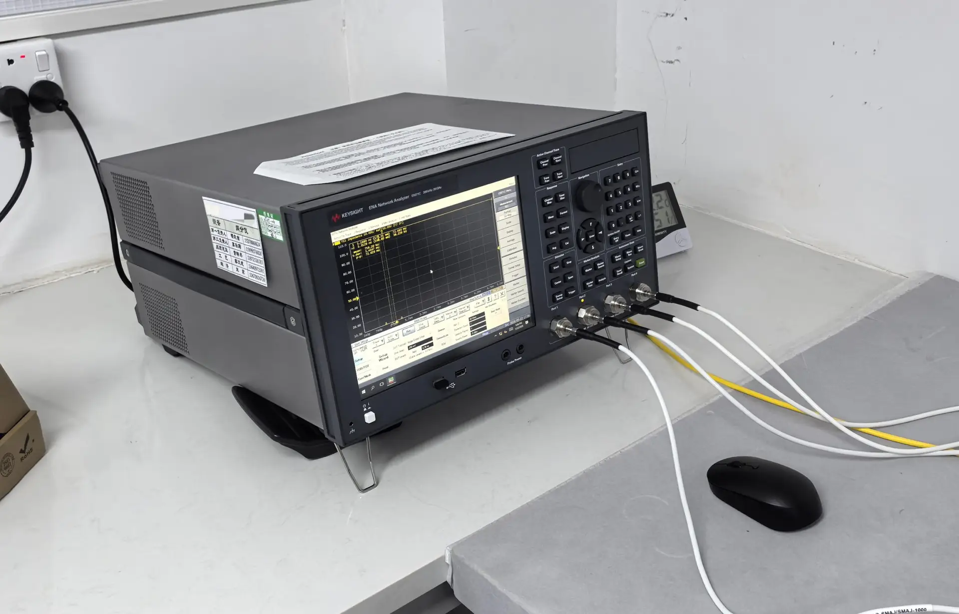 Keysight ENA Network Analyzer E5071C performing high-frequency measurements for PCB signal integrity analysis in a lab setup.