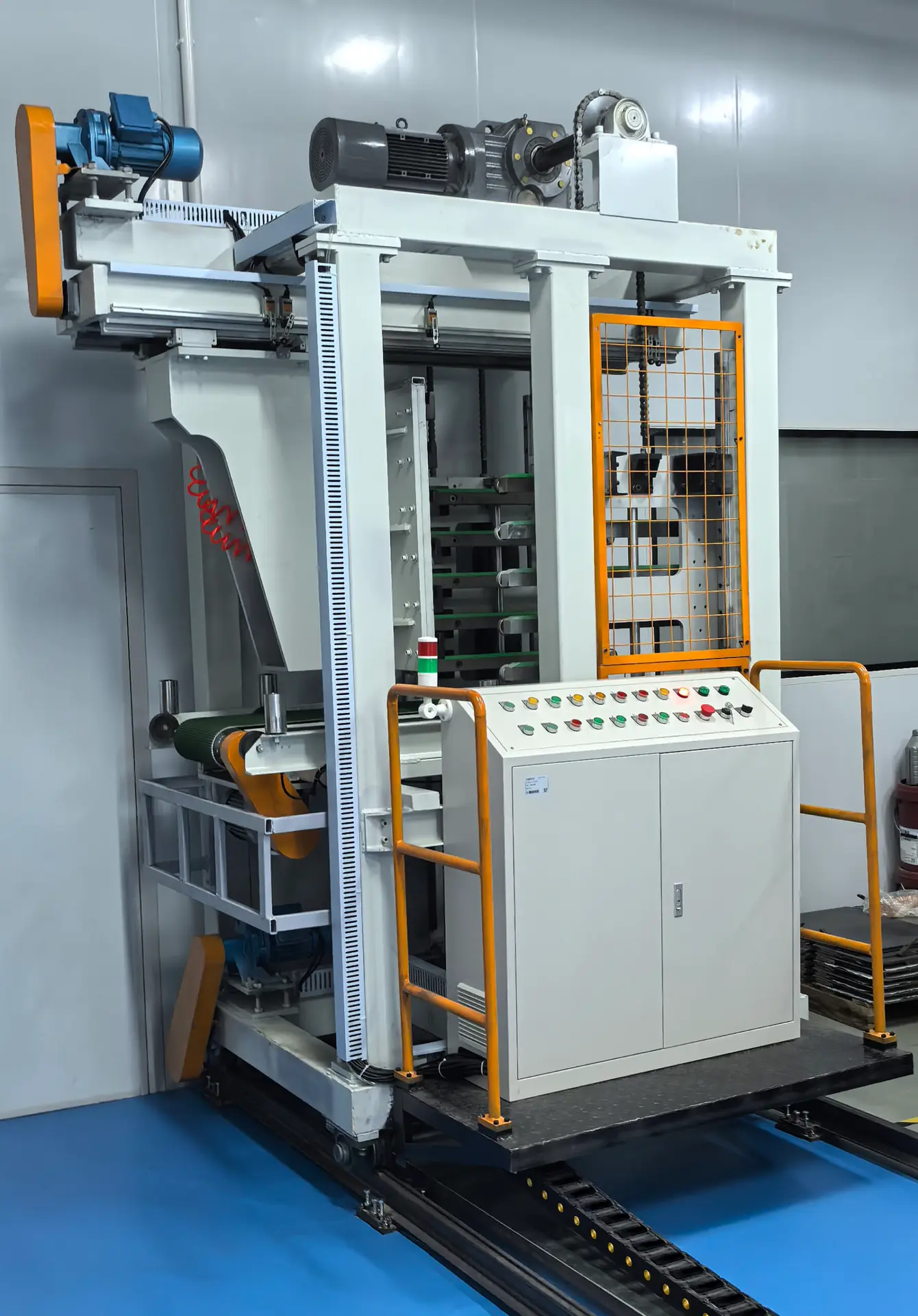 Automated PCB material handling machine featuring vertical transport, conveyor belts, and a control panel for efficient circuit board processing.