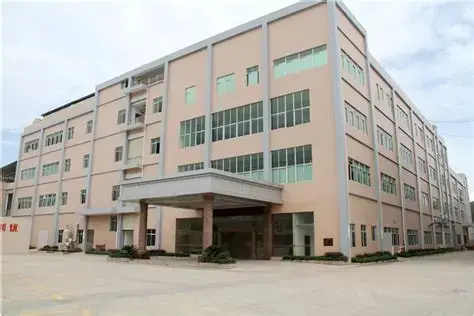 Modern multi-story building, an advanced PCB manufacturing and assembly plant, specializing in high-quality printed circuit board production.
